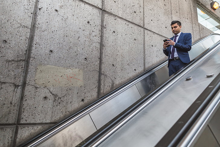 people, man, formal, escalator, wall, infrastructure, building