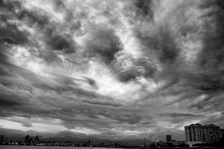 black-and-white, buildings, clouds, dark, outdoors, overcast, sky
