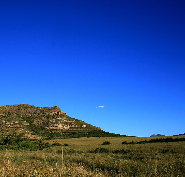 hill, slope, grass, green, earthy, rocky, very blue sky