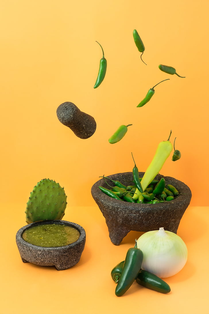 green, chili, peppers, gray, mortar, pestle, beside