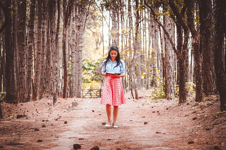 woman, wearing, blue, pink, dress, walking, reading