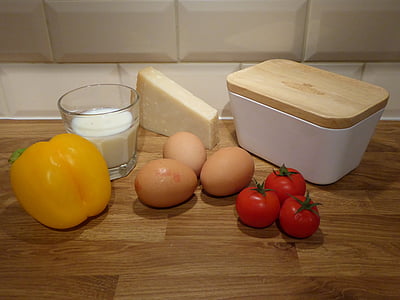 food, eggs, tomatoes, cheese, butter, peppers, milk
