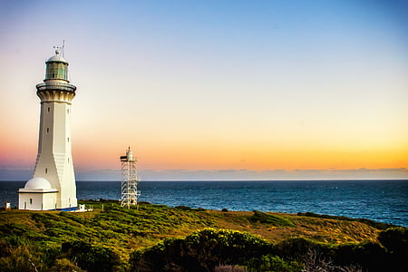 white, lighthouse, near, body, water, ocean, sea