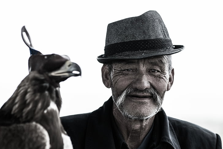 animal, bird, black-and-white, elderly, hat, man, mustache