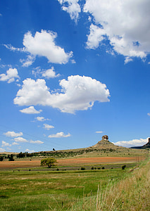 rocky outcrop, veld, green, grass, sky, loose clouds, landscape