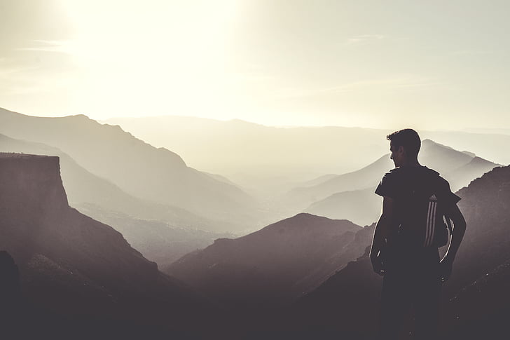 silhouette, man, standing, overlooking, mountain, ranges, daytime