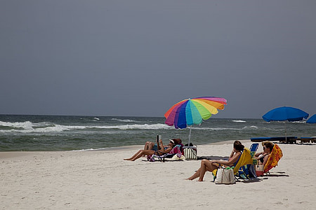 sunbathers, beach, sand, white, ocean, waves, umbrella