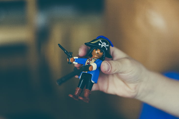 selective, focus, person, holding, pirate, lego, minifig