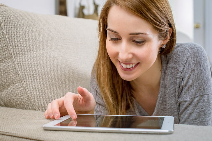 woman, tablet, relaxes, living room, communication, smile, computer