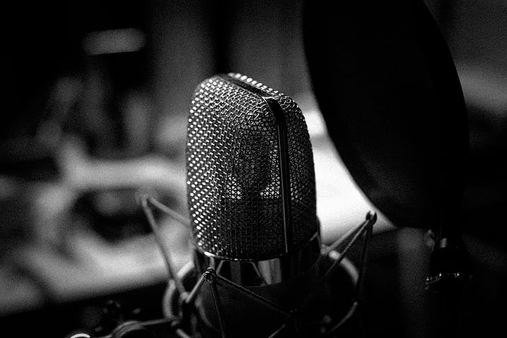 music, microphone, black and white, focus on foreground, people, recording studio, indoors