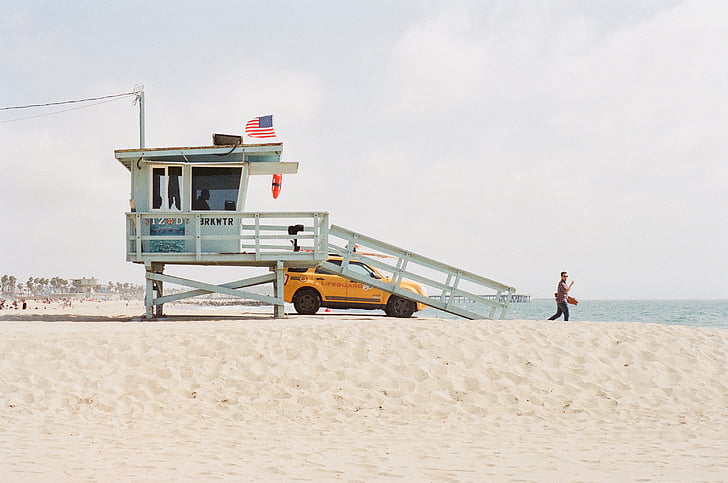 person, dessert, daytime, beach, sand, lifeguard, truck