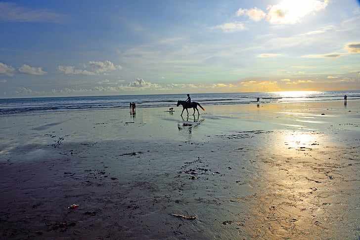 jimbaran beach, jimbaran, bali, indonesia, low tide, beginning of sun setting, horse riding
