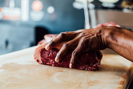 person, holding, chopped, meat, table, daytime, food