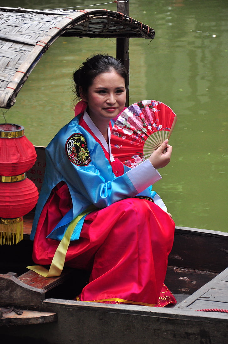 chinese woman with fan, chinese woman on boat, chinese woman, one person, red, full length, holding