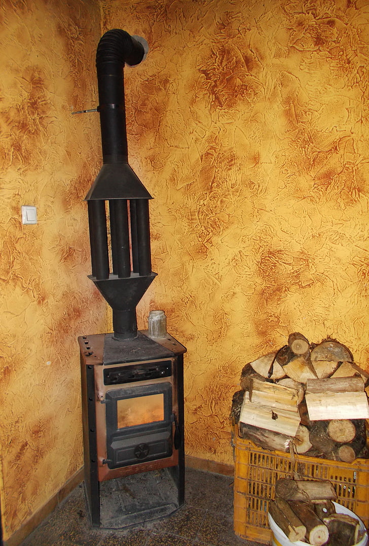 l'estufa antiga, estufa de ferro, Calefacció de fusta