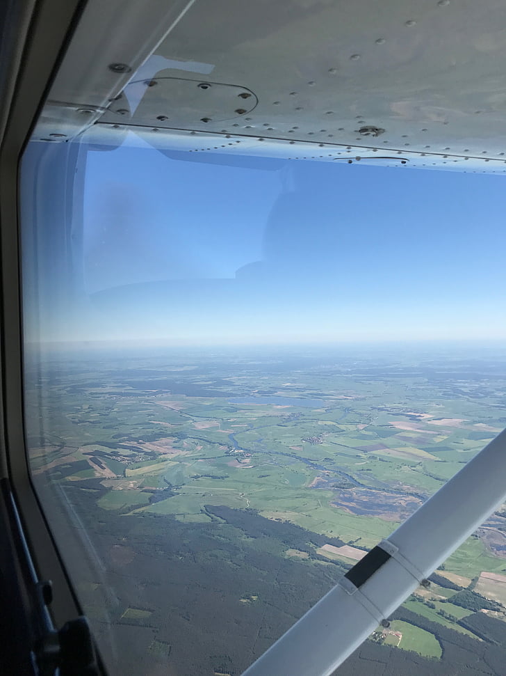 aircraft window, outlook, sky, blue, green, strut, wing