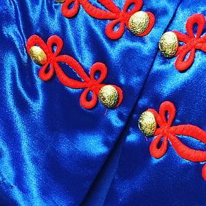 blå satin guld knappar, kostym, enhetlig närbild