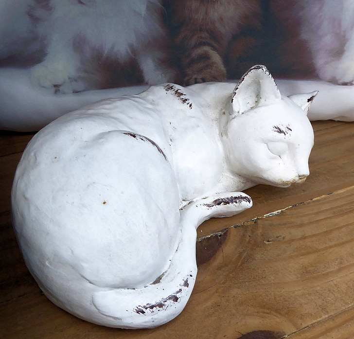 sleeping cat, painted clay, outdoors, garden ornament
