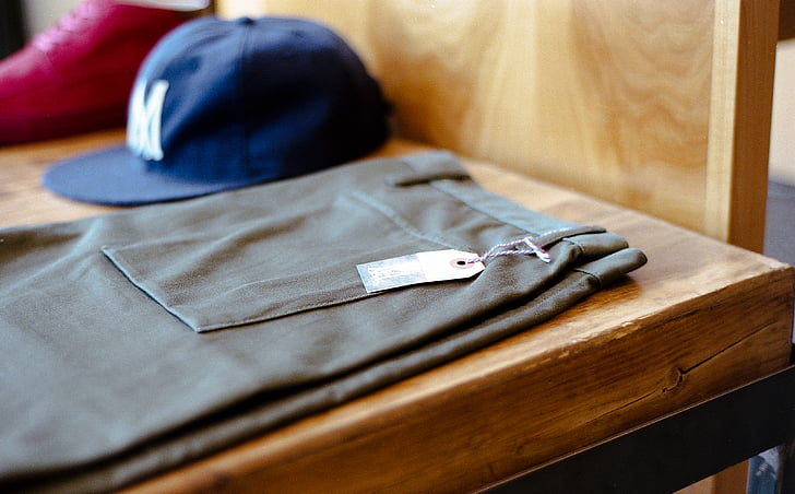 table, pants, cap, shoes, clothes, tag, clothing