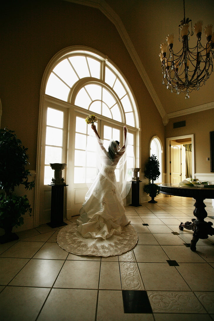 bride, joyful, bridal gown, window, wedding day, bouquet, romantic