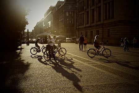 silhouette, photo, group, people, bicycles, near, concrete
