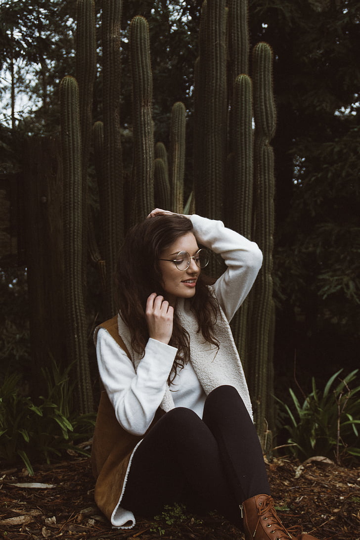 woman, sitting, near, cactus, day, time, adult