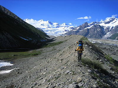 backpacker, hiking, glacial moraine, wrangell–st elias, national park and preserve, alaska, usa