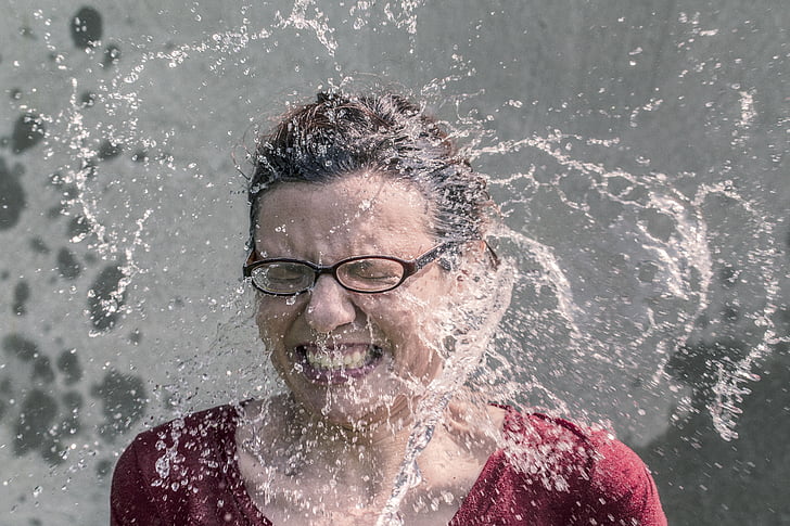 water, spreads, woman, s, face, wearing, red