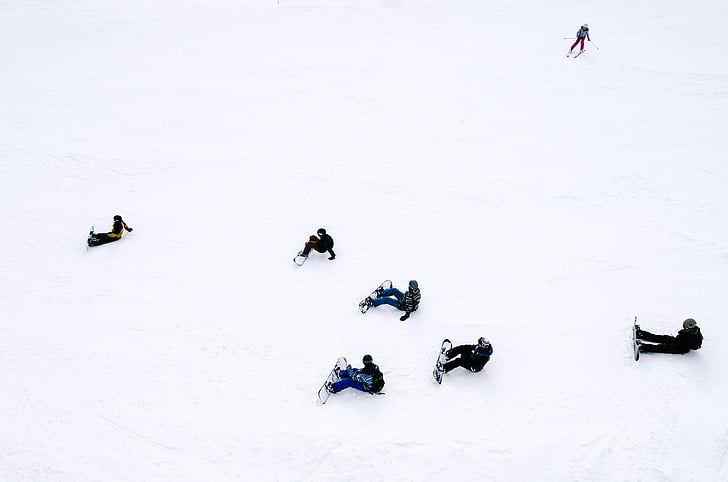 people, snowboards, sitting, snow, daytime, winter, white