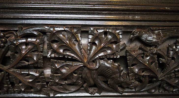 detail, medieval oak carving, stylised acanthus leaf, wild boar, raven, ightham mote, kent