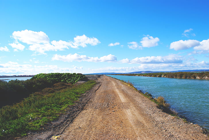 brown, road, beside, body, water, white, clouds