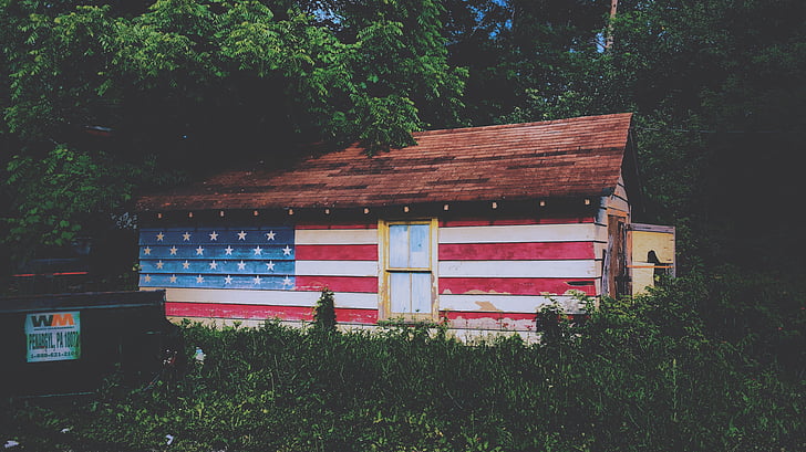 architecture, cabin, flag, grass, house, trees, wooden