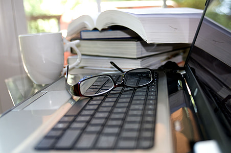 pc, computer, apple, screen, cup of coffee, sunglasses, stack of books