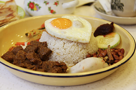 asian food, beef, rendang, cucumber, fish cake, coconut, rice