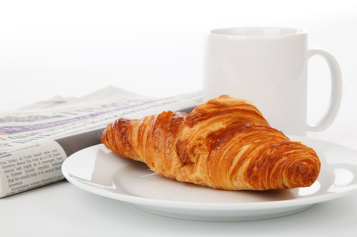 bread, croissant, cup, food, mug, newspaper, plate