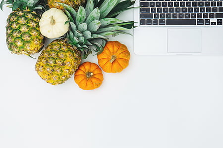 two, pineapples, pumpkins, near, laptop, computer, pineapple