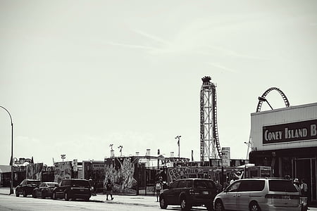 amusement park, black-and-white, cars, city, outdoors, rides, road