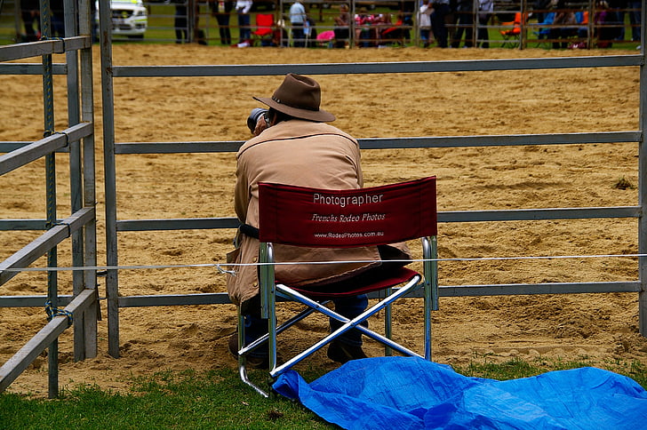 photographer, chair, rodeo, fence, camera, sitting, male