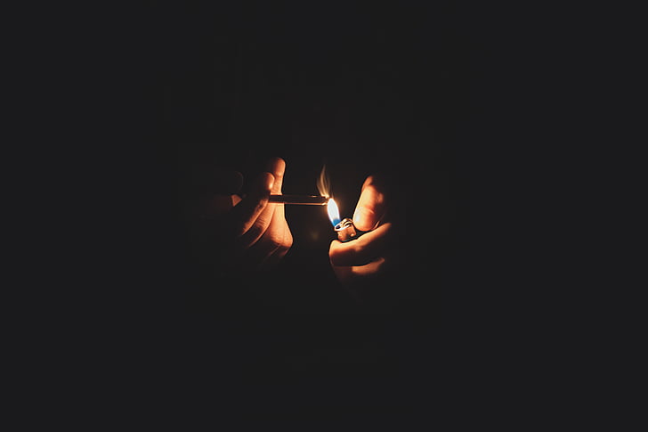 person, holding, blunt, lighted, lighter, fire, flame