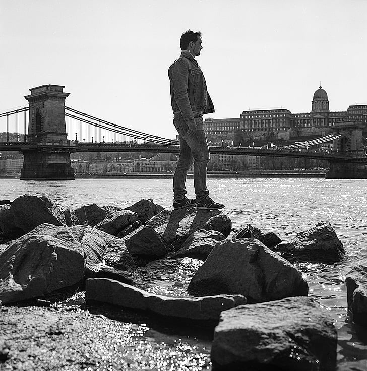 river, young man, balance, rocks, bridge, budapest, black And White
