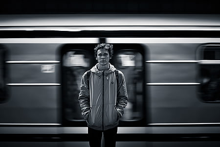 black and white, man, person, train, public transportation, motion, underground