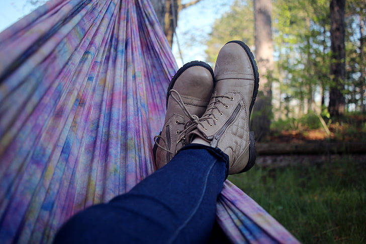 person, lying, hammock, wearing, brown, shoes, relax