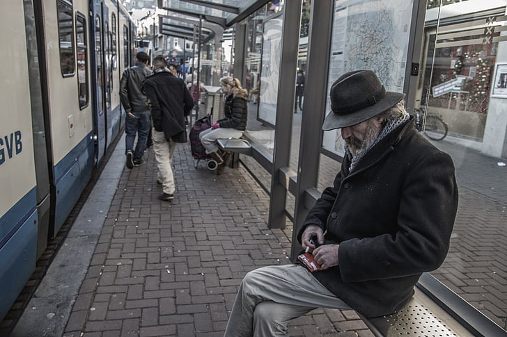 man, wearing, coat, hat, sitting, train, station