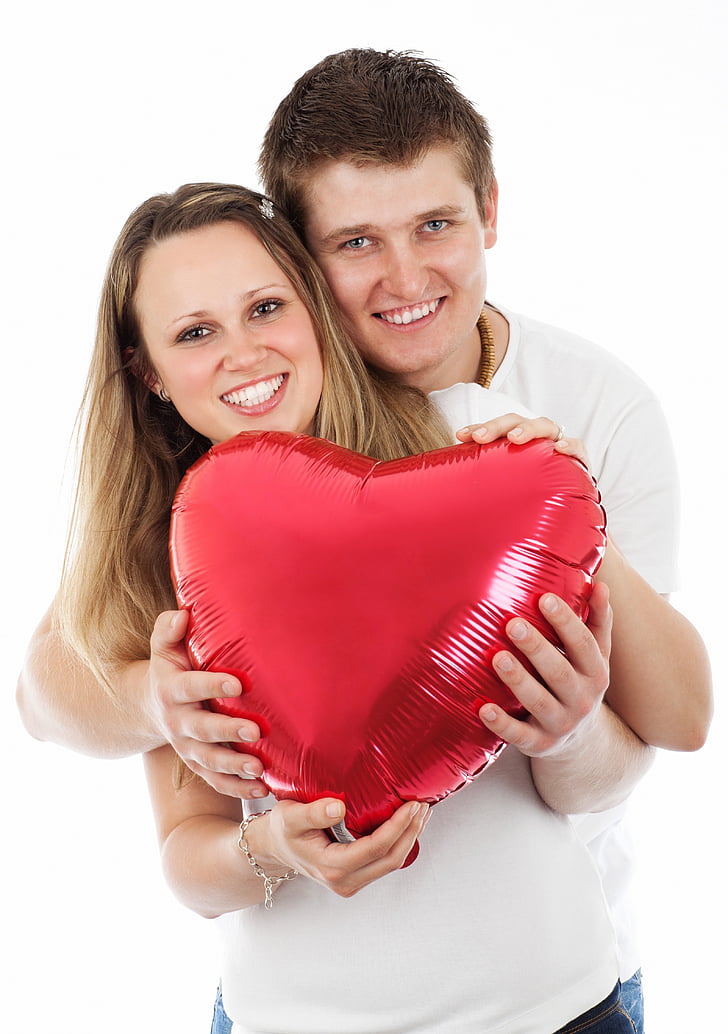 couple, holding, red, inflatable, heart, shape, balloon