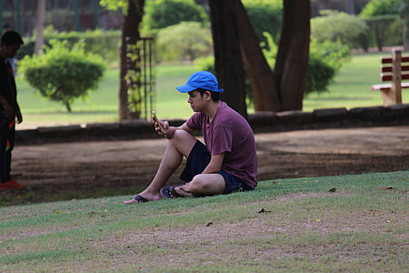 pessoa, sentado, macho, relaxante no parque, ao ar livre, desporto, pessoas