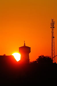 water tower, radio tower, sunset, silhouette, orange, sun, madagascar