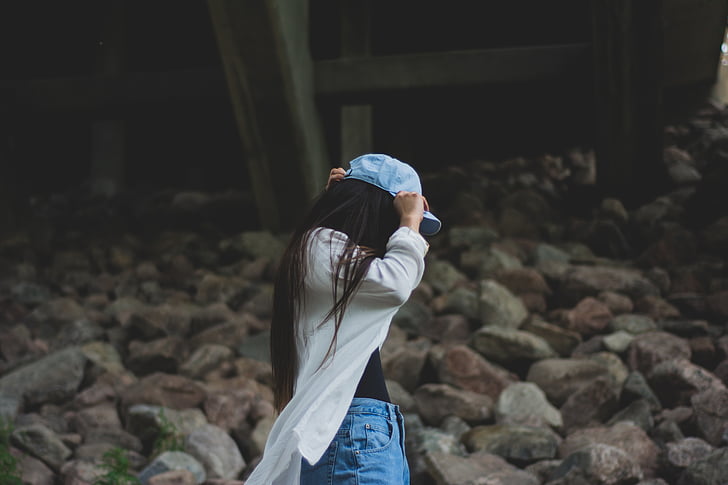 girl, person, female, young, takinf off, hat, cap