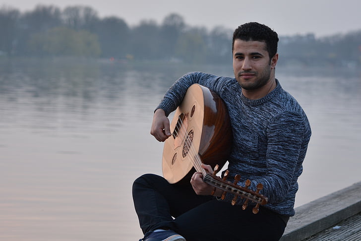 lake, leisure, man, musical instrument, musician, outdoors, person