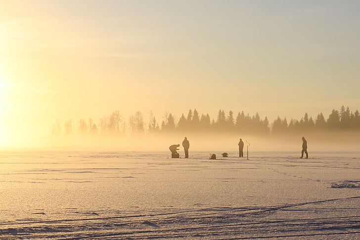the fisherman, on the ice, on a winter day, cold temperature, winter, fog, snow