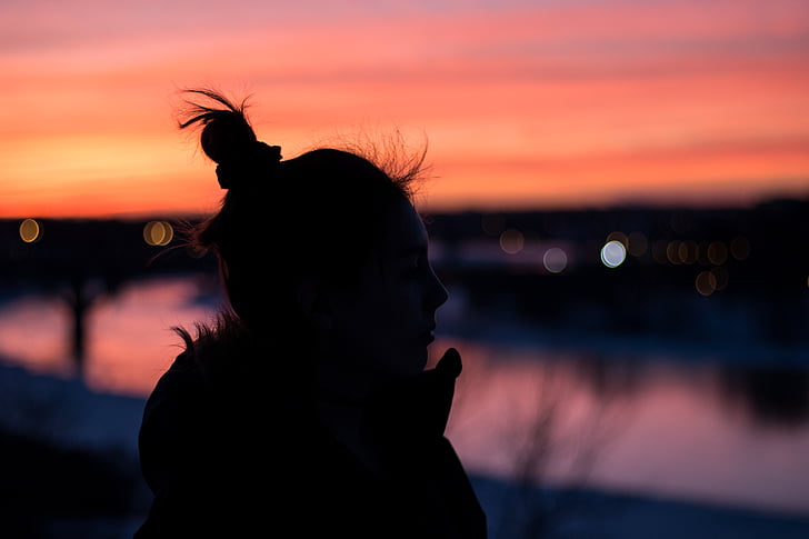silhouette, photo, woman, standing, near, river, sunset